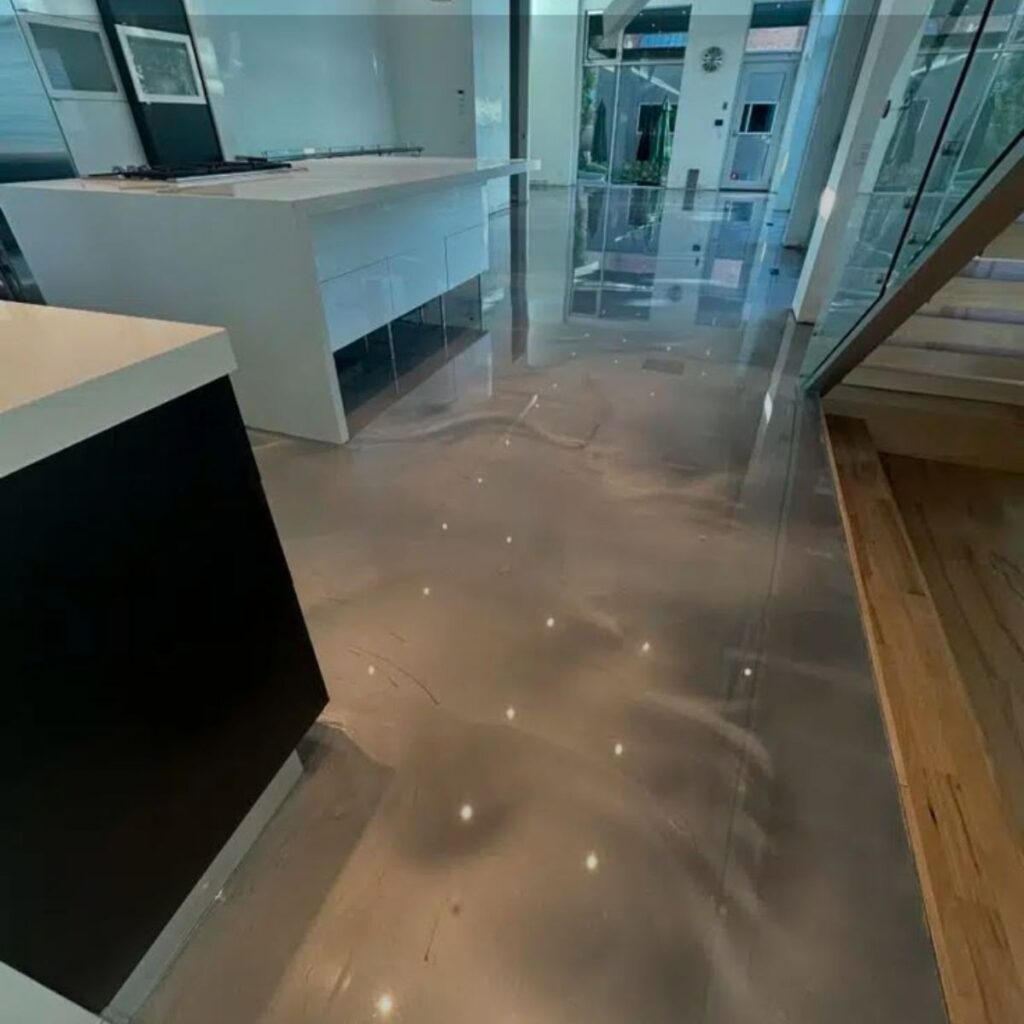 Modern home interior with glossy metallic epoxy flooring in Lakewood Ranch, FL.
