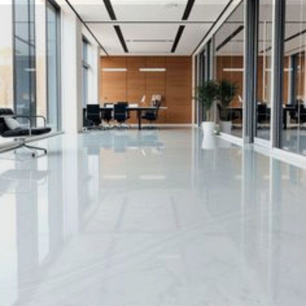 Modern office corridor with glossy white epoxy flooring in Lakewood Ranch, FL.