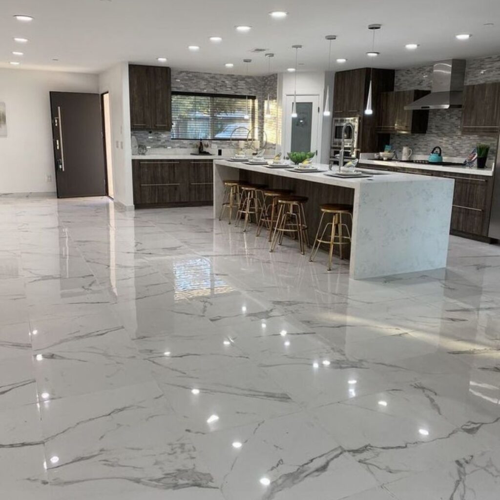 Modern kitchen featuring a glossy marble-look epoxy countertop and Epoxy Flooring North Port FL.