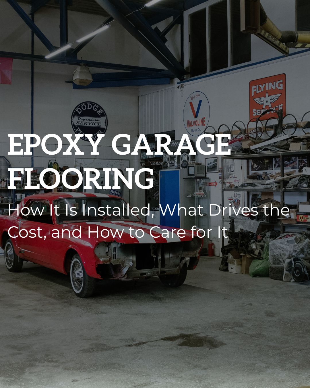 Epoxy garage flooring guide image showing a classic car workshop with a concrete garage floor and automotive workspace.